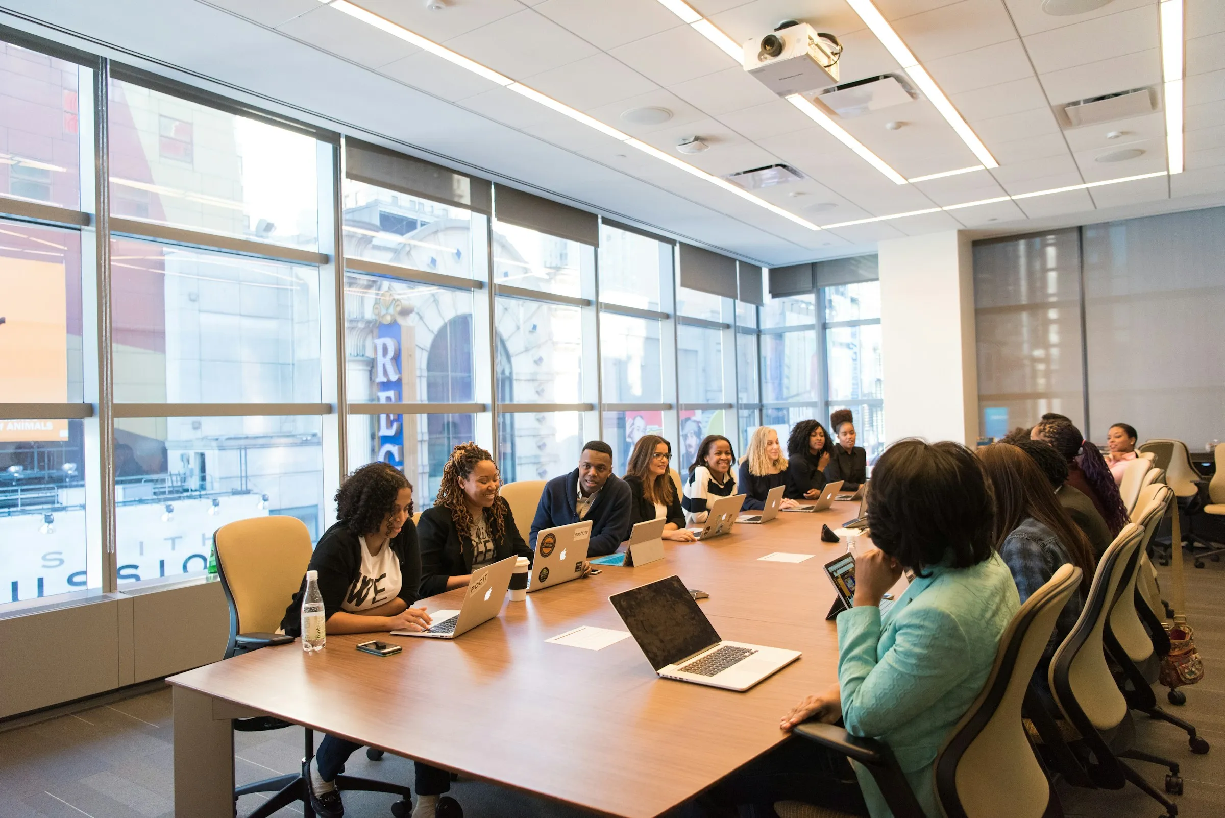 A team discussing an itinerary around a meeting table